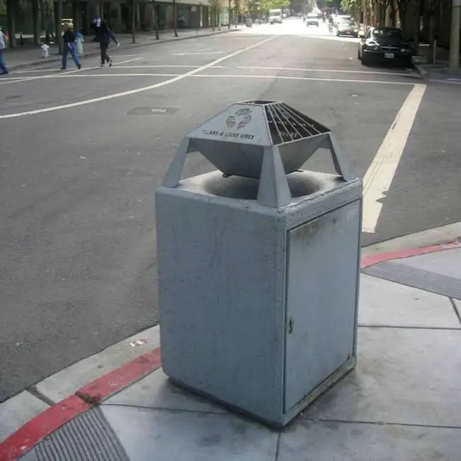 Public trash cans with small openings
